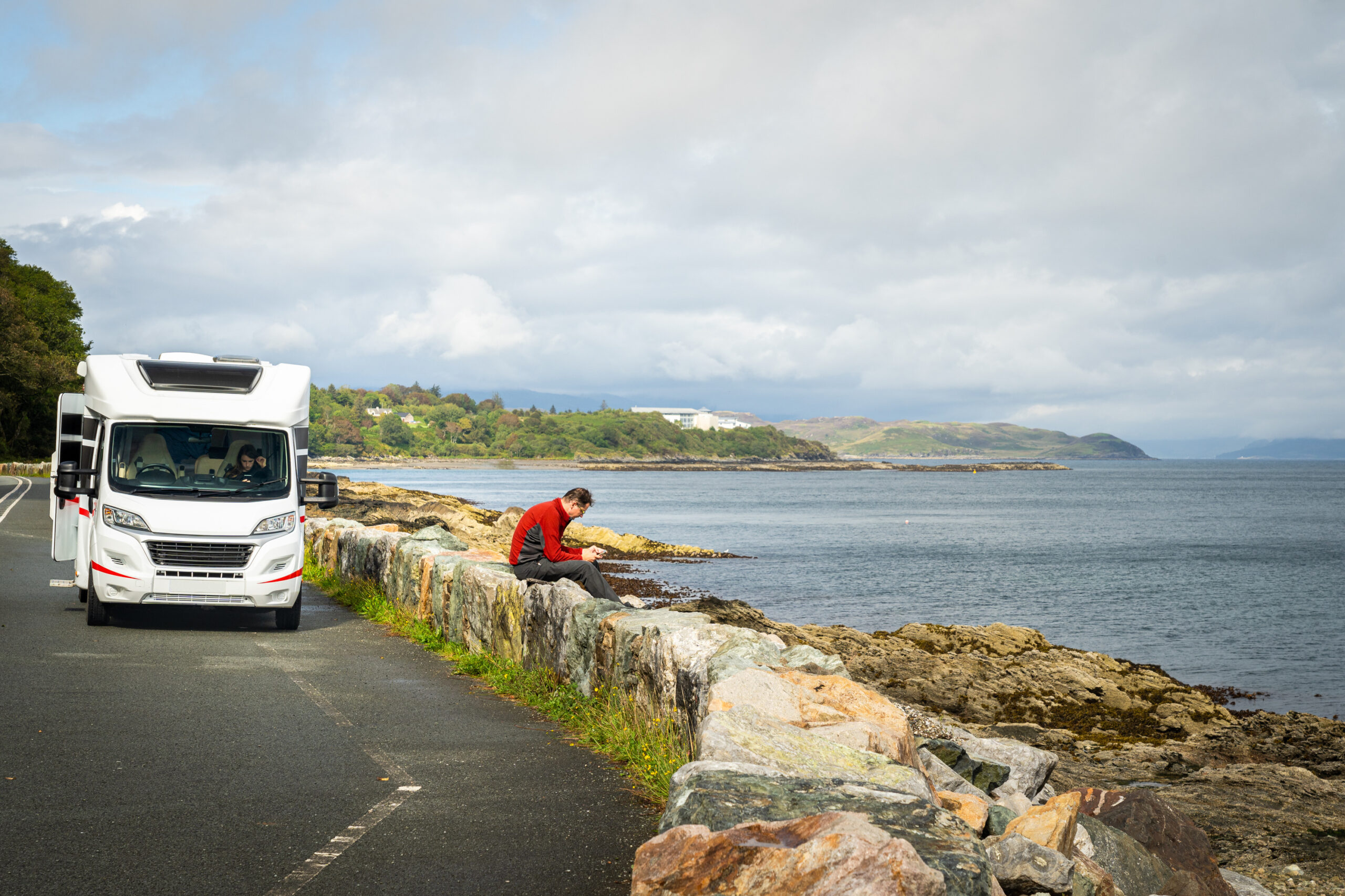Guy sat chilling outside a motorhome